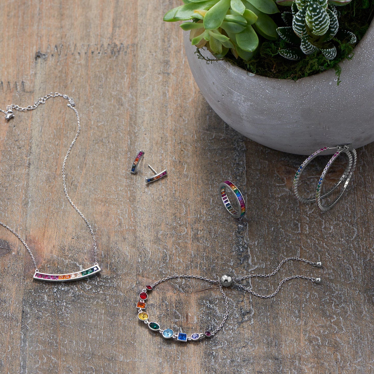 16" with a 2" extension.Rhodium Plated Rainbow CZ Necklace