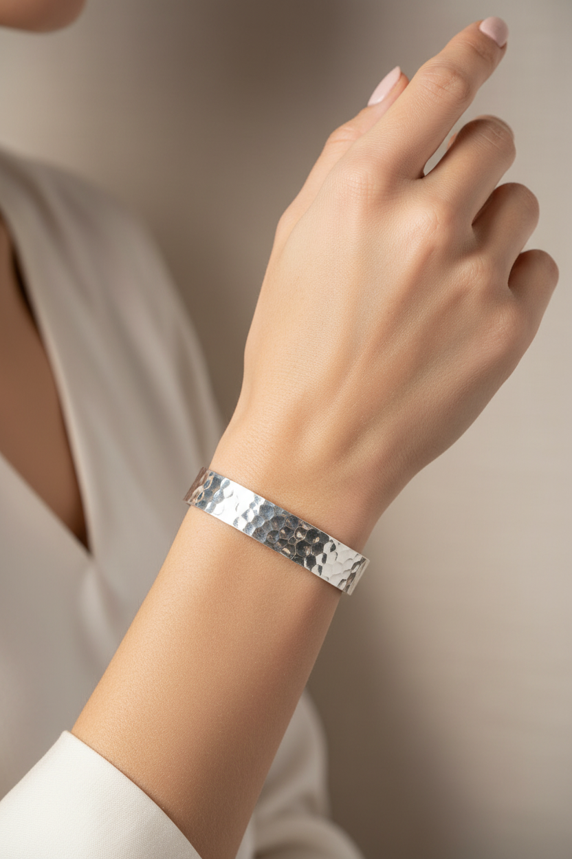 Female model wearing hammered cuff bracelet - elegant pose