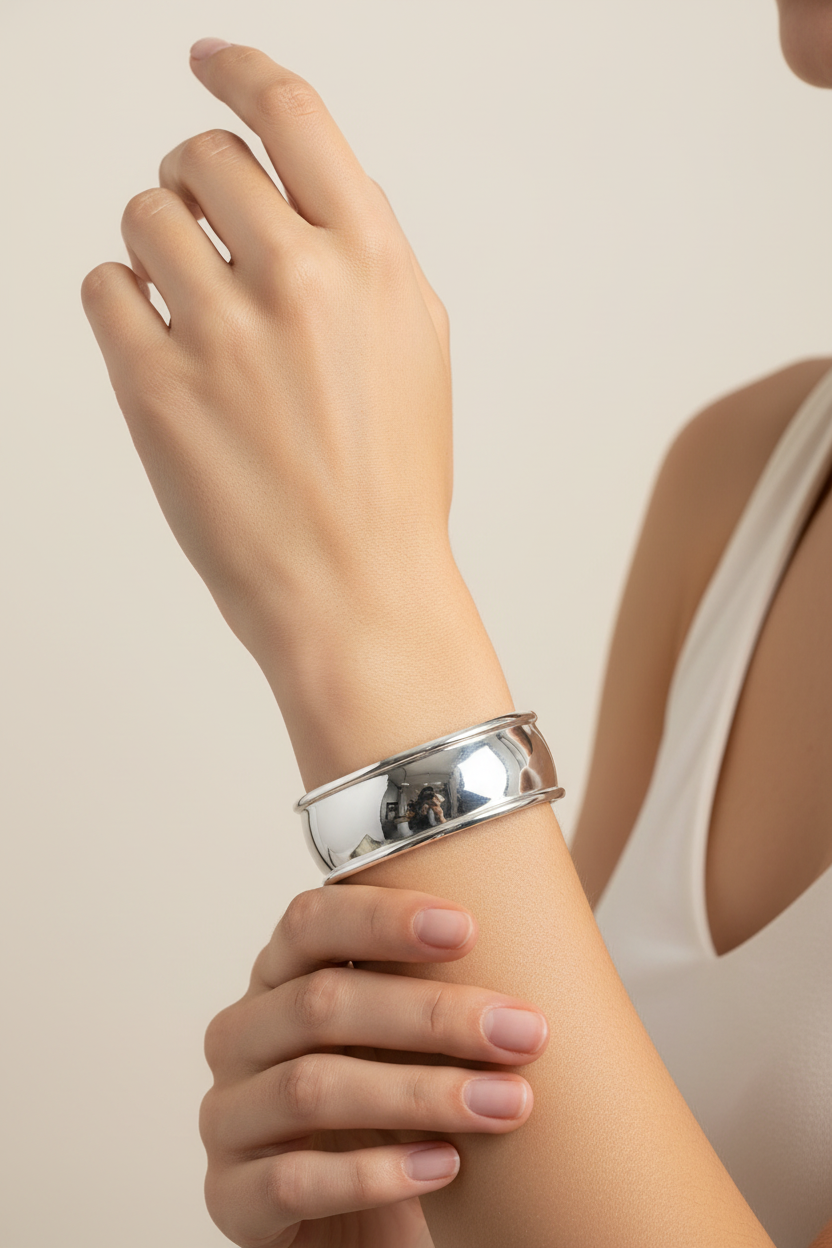Female model wearing polished cuff bracelet - elegant pose