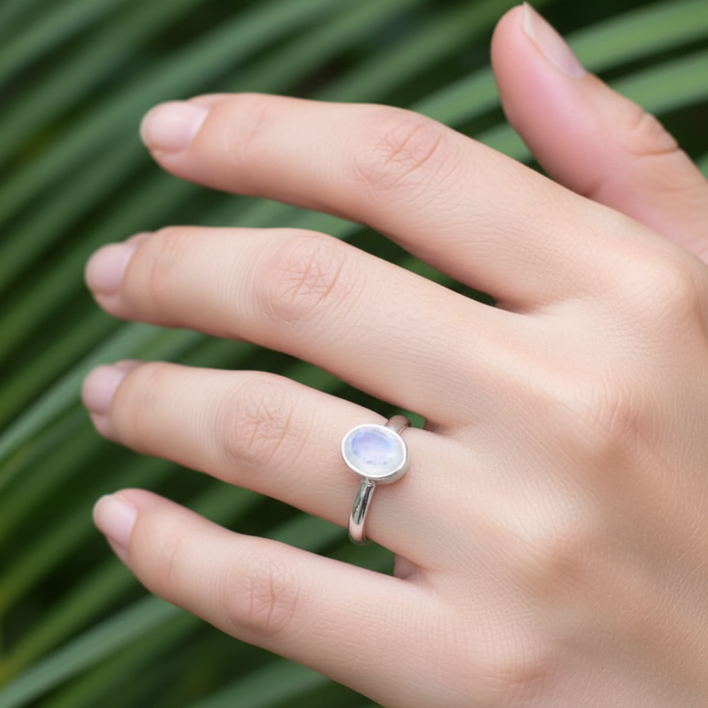 Oval Moonstone Bezel Silver Ring Different Female Hand Green Tropical Leaves Background 1x1
