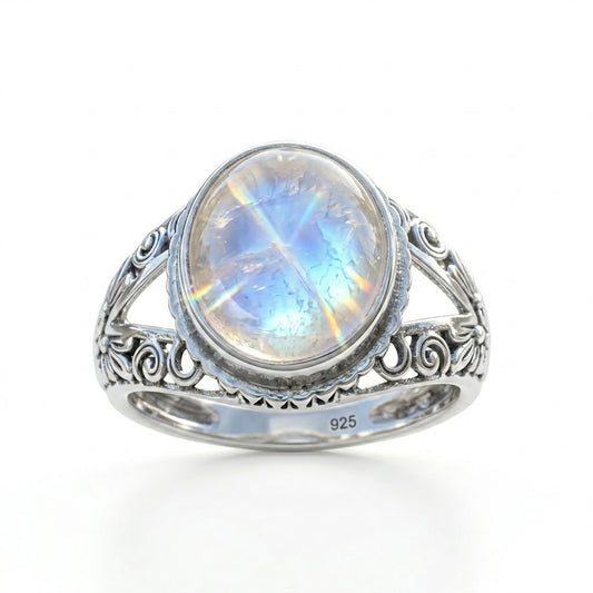 Silver ring with a rainbow moonstone on a white background