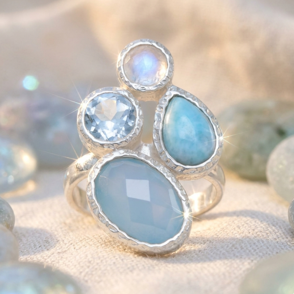 Silver ring with blue gemstones on a soft focus background