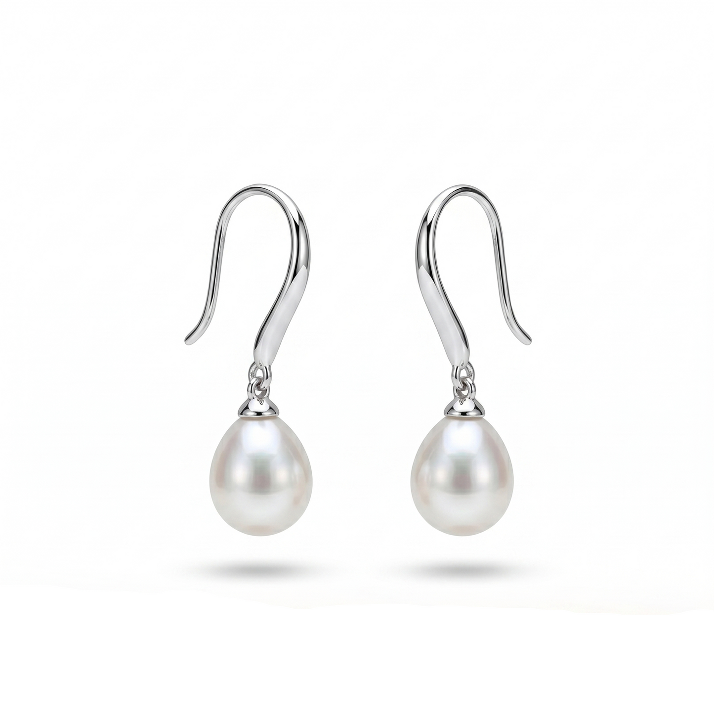 Pearl earrings with silver hooks on a white background