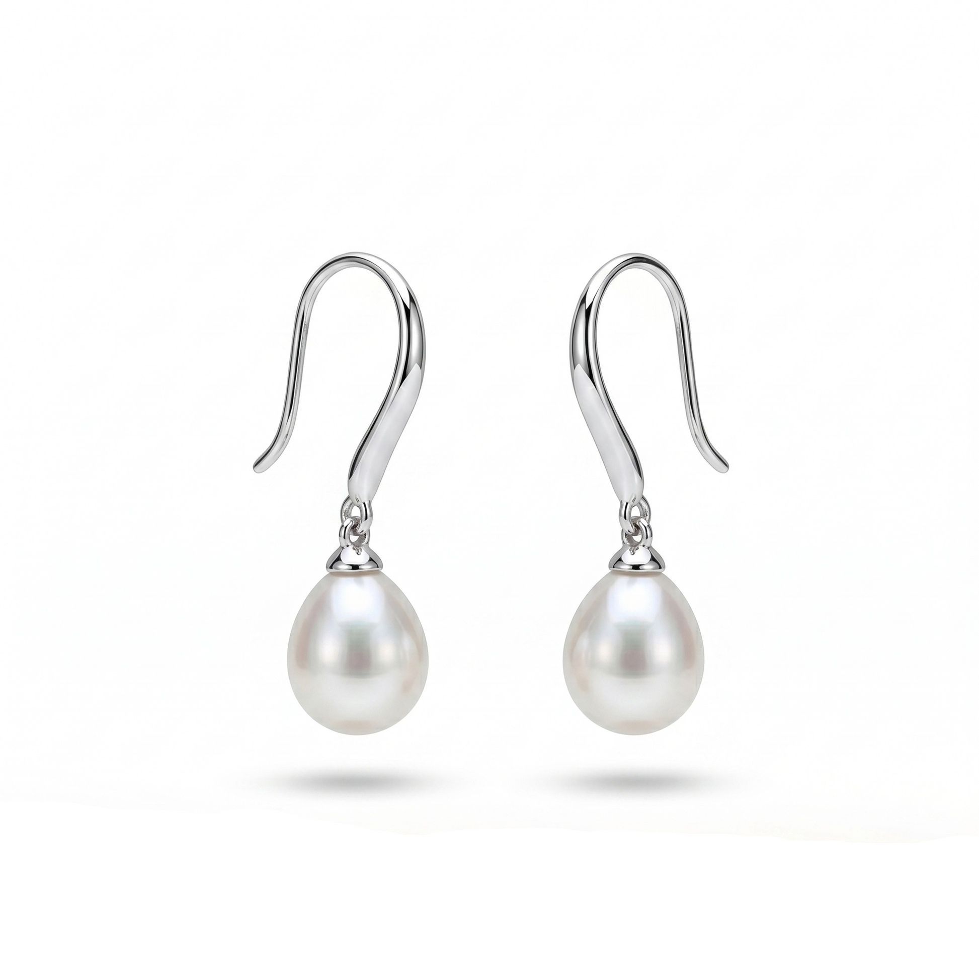 Pearl earrings with silver hooks on a white background