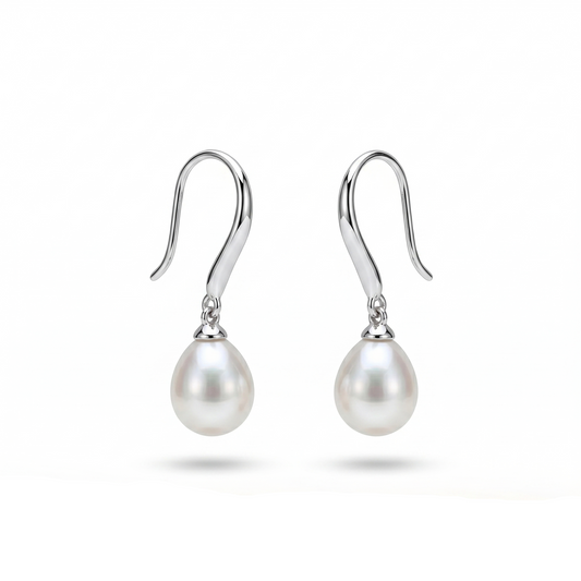 Pearl earrings with silver hooks on a white background