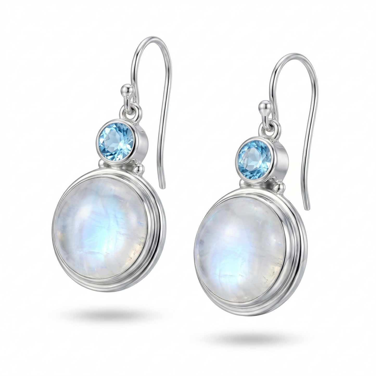 Silver earrings with moonstone and blue gemstones on a white background