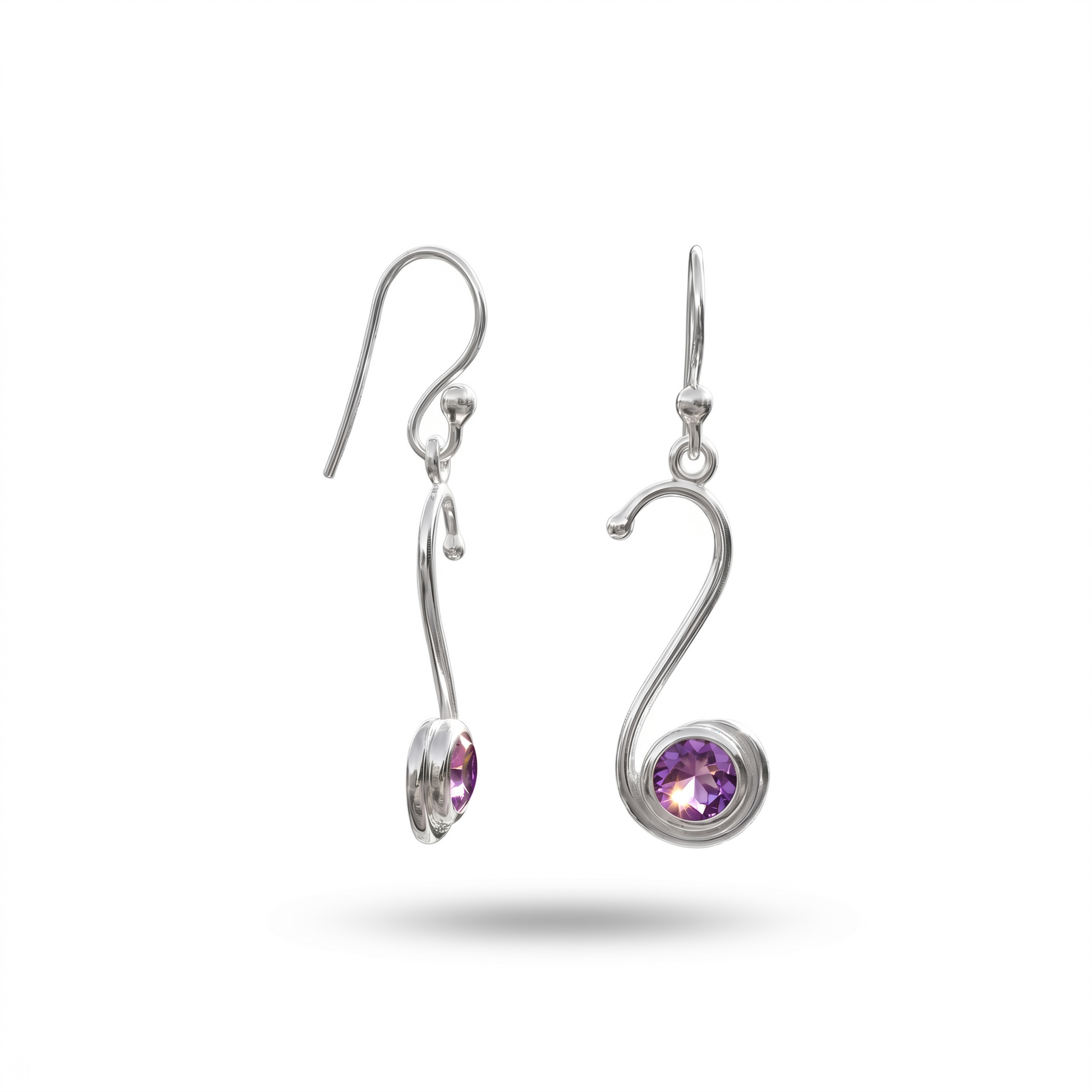 Silver earrings with purple gemstones on a white background