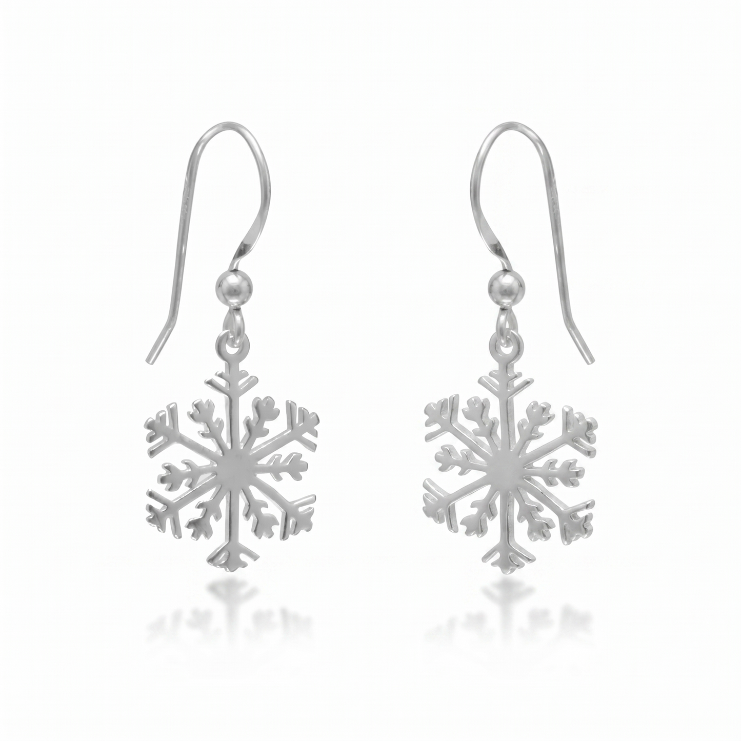 Silver snowflake earrings on a white background
