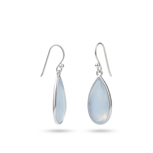 Teardrop-shaped earrings with light blue stones on a white background