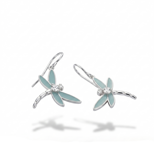 Dragonfly-shaped earrings with light blue wings and silver bodies on a white background