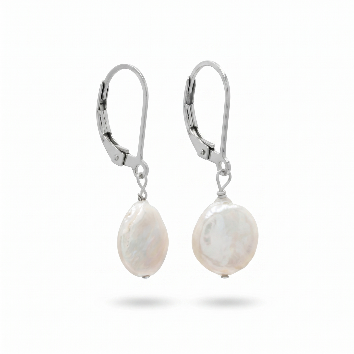 Pair of pearl earrings with silver hooks on a white background