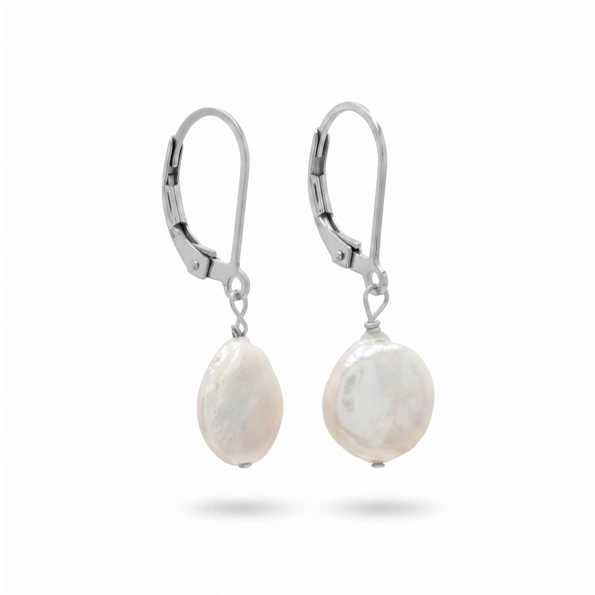 Pair of pearl earrings with silver hooks on a white background