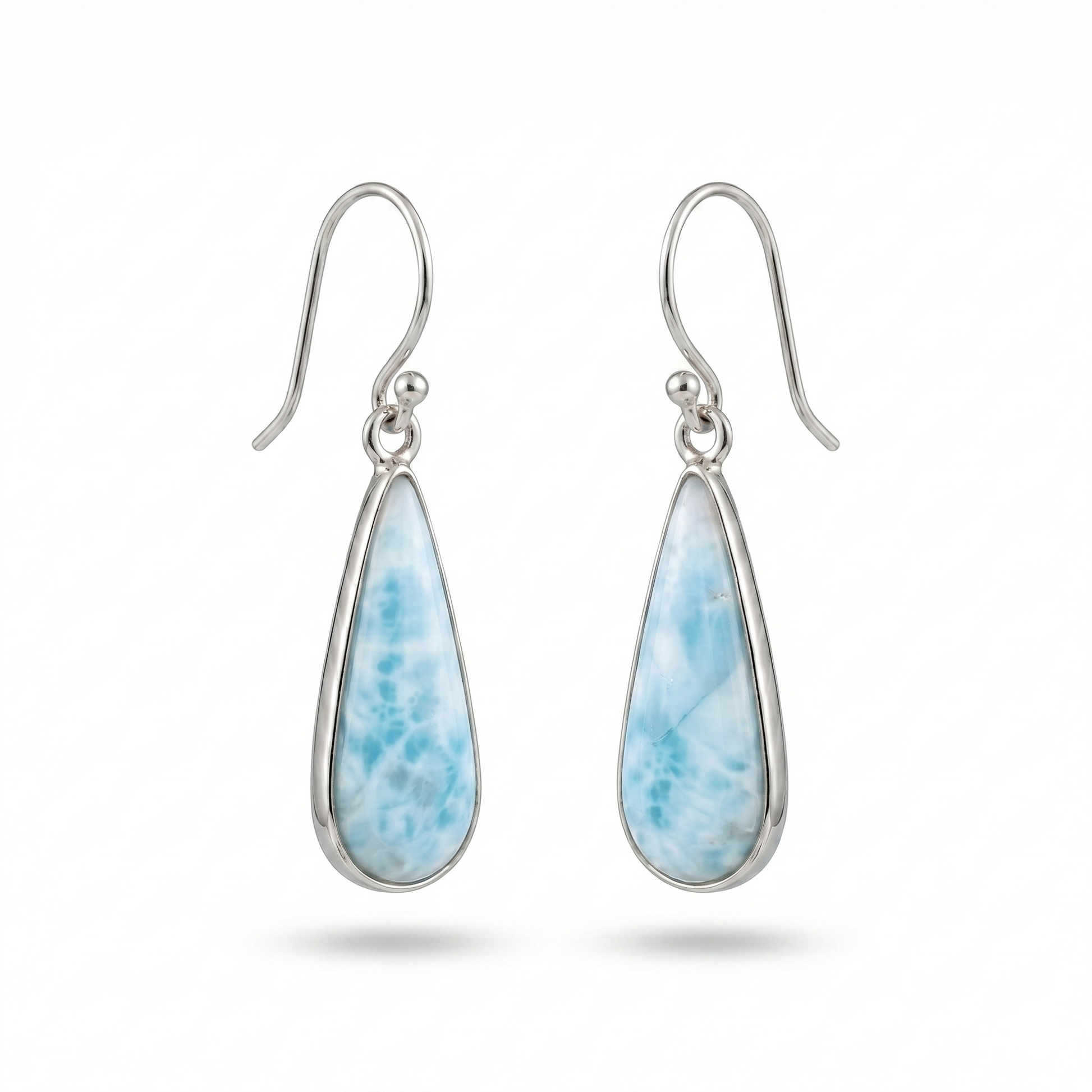Teardrop-shaped earrings with blue speckled stones on a white background