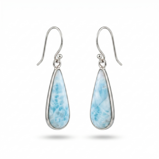 Teardrop-shaped earrings with blue speckled stones on a white background