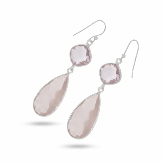 Pair of earrings with pink teardrop-shaped stones on a white background