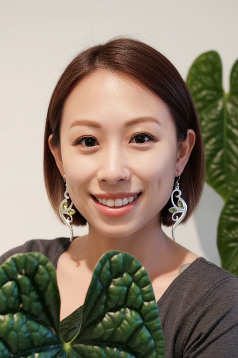 Asian woman with peridot vine earrings