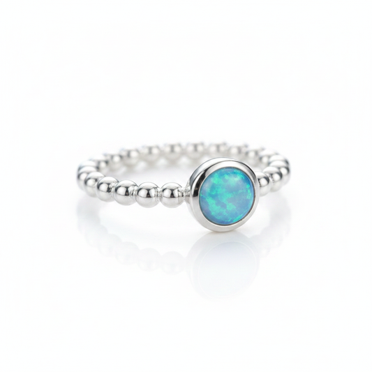 Blue Opal Round Beaded Band Silver Ring Pure White Background Tilted Reflection 1x1