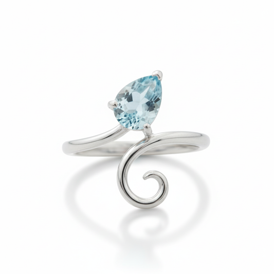 Blue Topaz Pear Bypass Swirl Silver Ring Angled White Background HD
