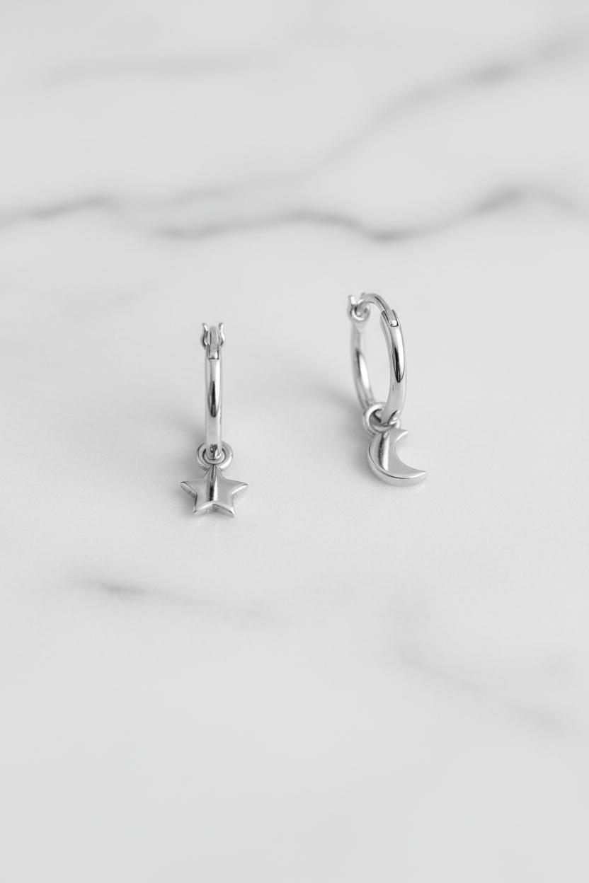 Celestial mismatch hoops on white marble