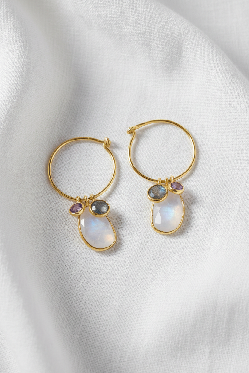 Celestial trio earrings on white linen fabric