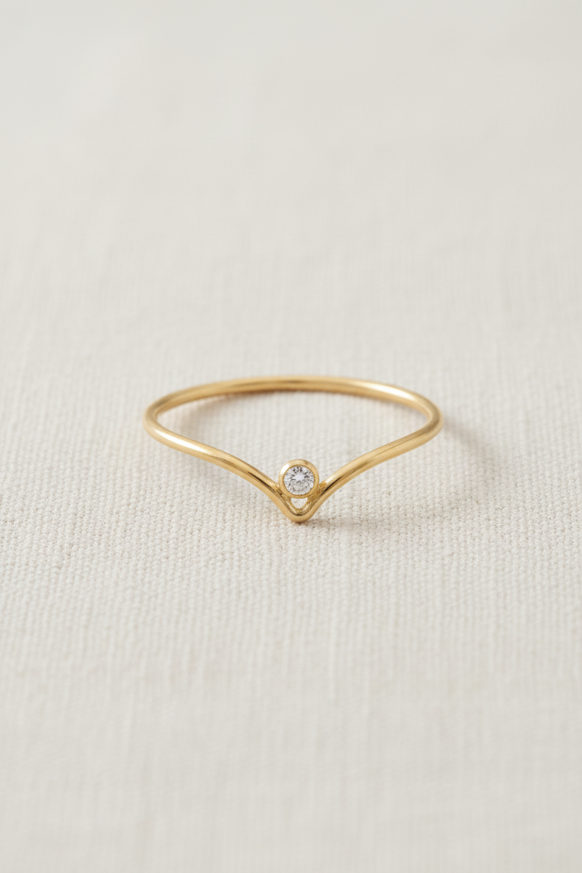 Chevron V-Shape Gold Ring on Linen Background