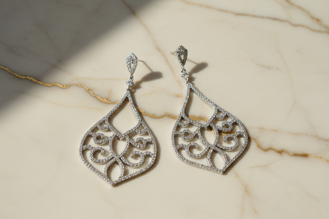 Earrings on cream marble with gold veining