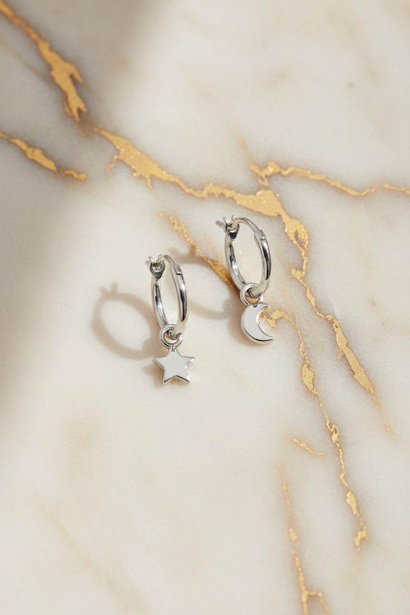 Earrings on cream marble with gold veining