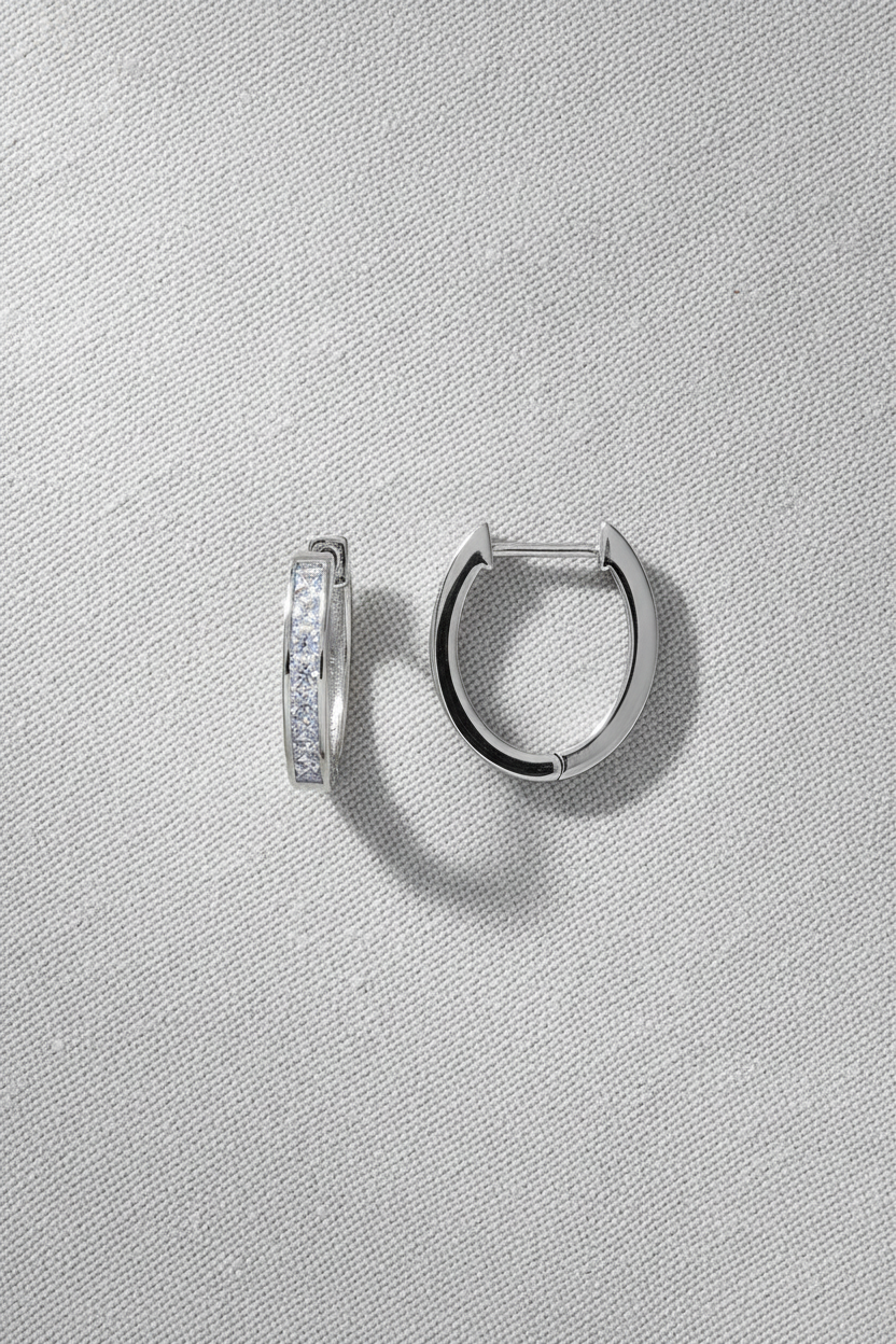 Earrings on pale grey linen