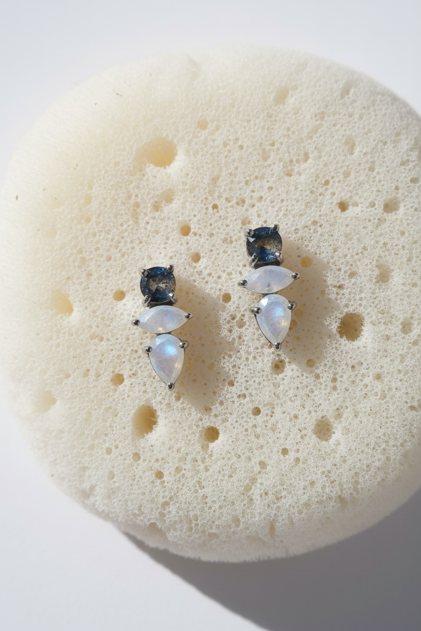 Earrings on soft white sea sponge