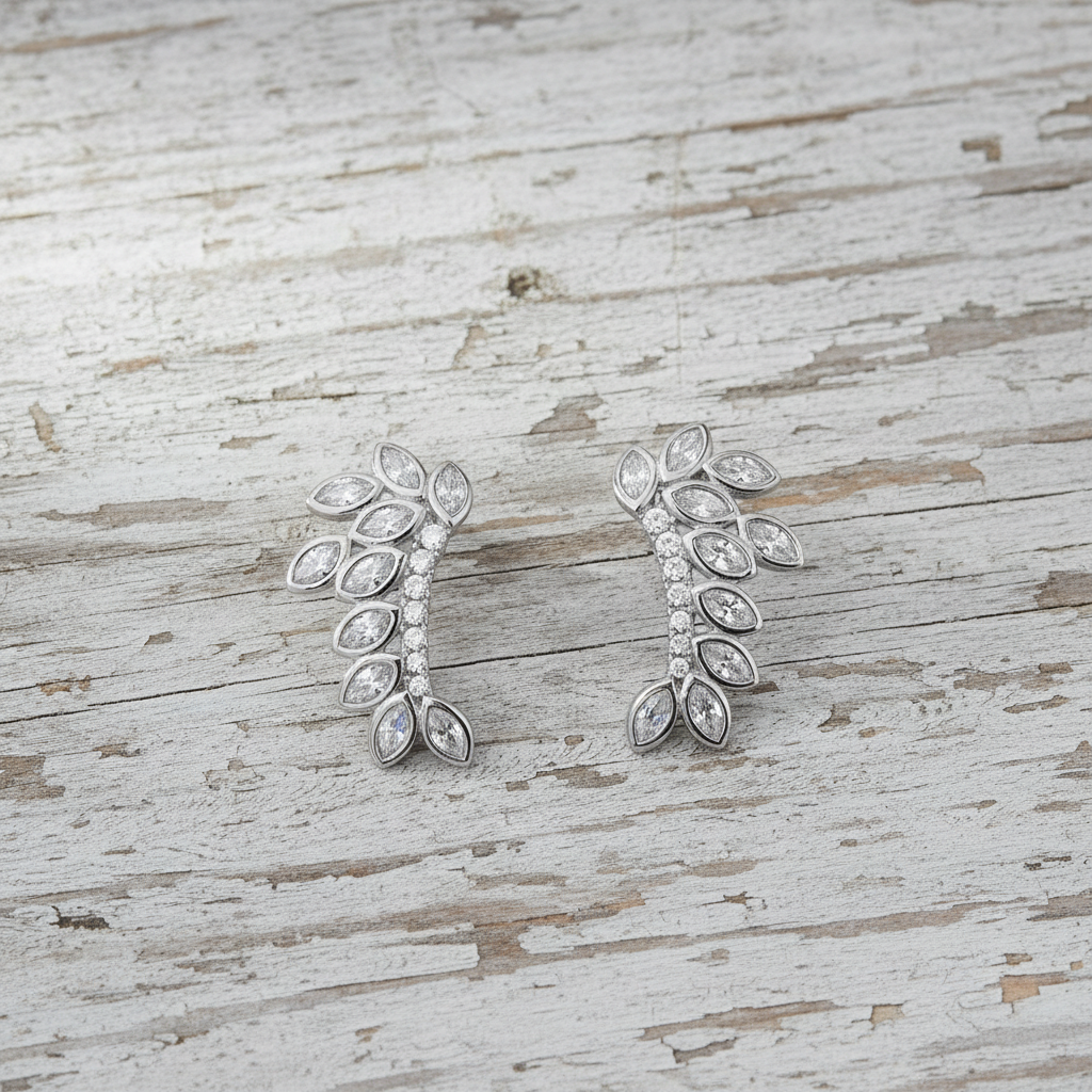 Earrings on whitewashed reclaimed wood