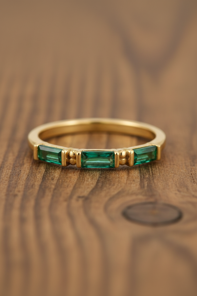 Emerald Green Baguette CZ Gold Ring Wood Background