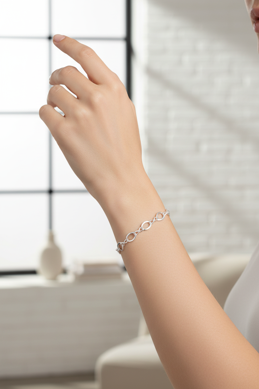 Female model wearing figure 8 bracelet - side angle