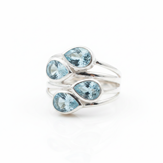 Four Stone Blue Topaz Multi-Band Silver Ring Pure White Background Tilted Reflection 1x1