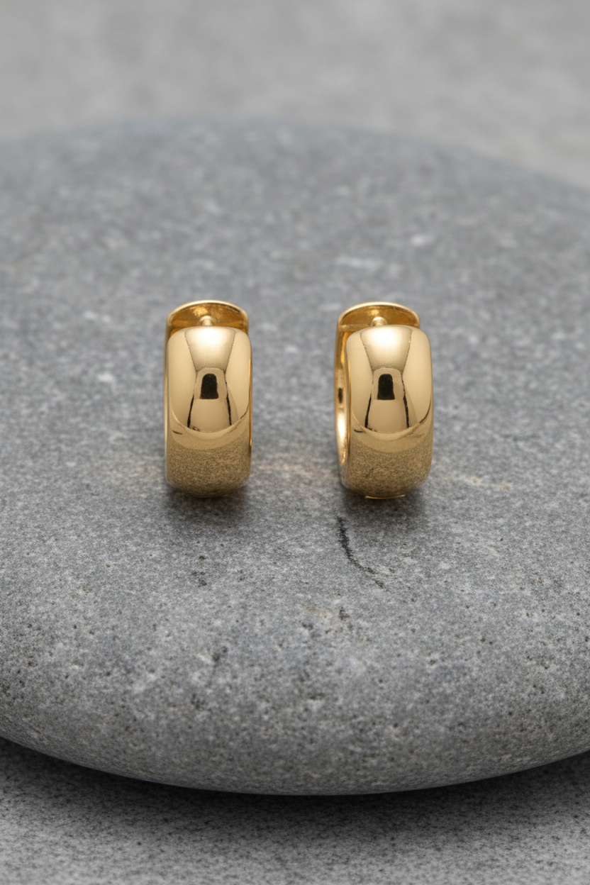 Golden embrace huggies on grey stone