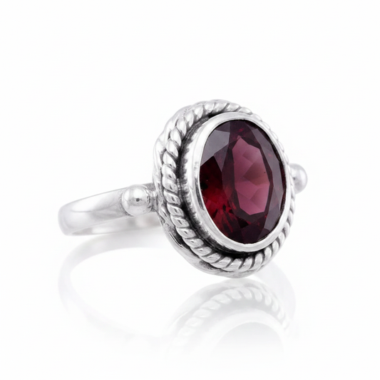 Large Oval Garnet Double Rope Bezel Ball Silver Ring Supplier Reference Pure White Background Tilted Reflection 1x1