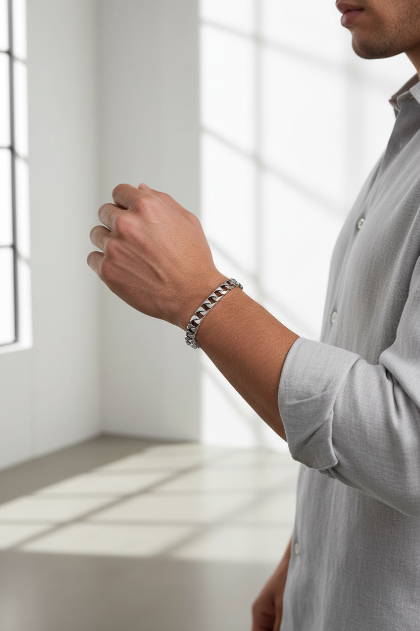 Male model wearing Cuban link chain bracelet - side angle