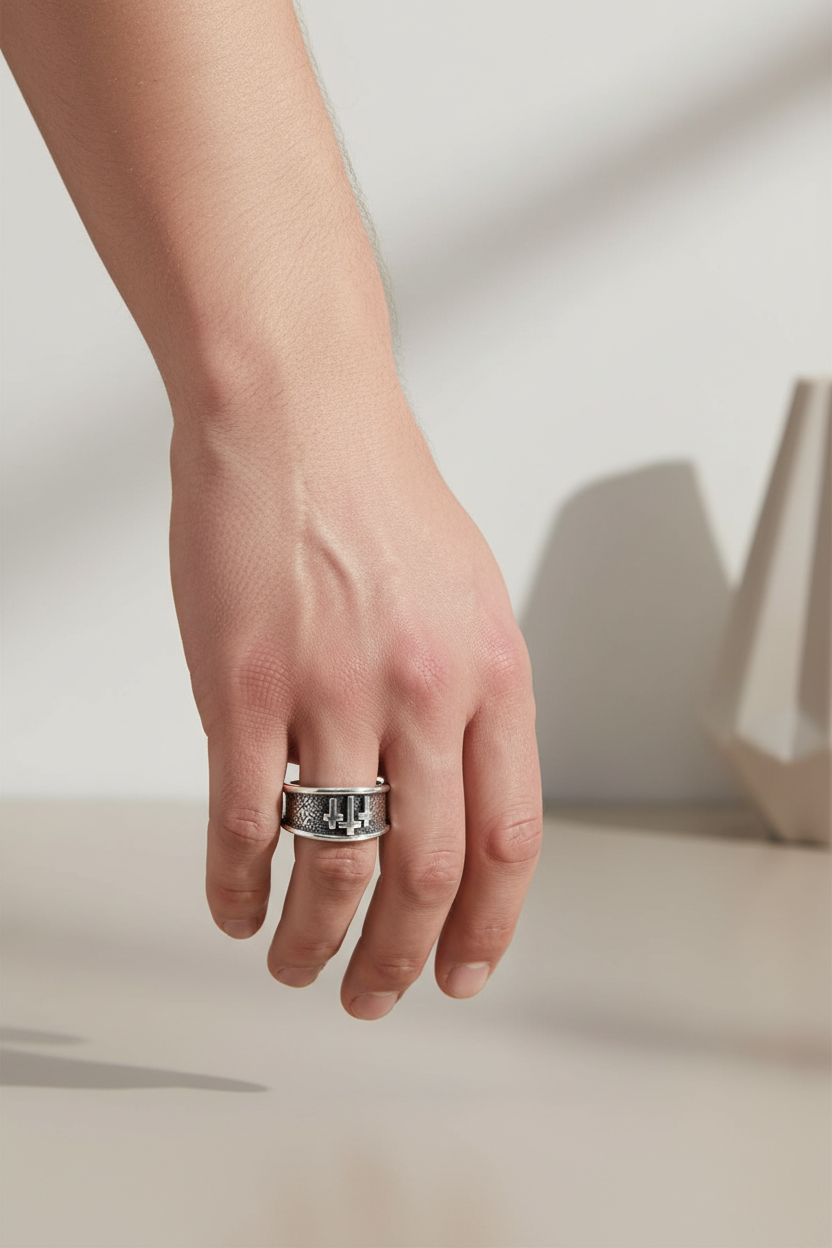 Male model wearing three crosses ring - side angle