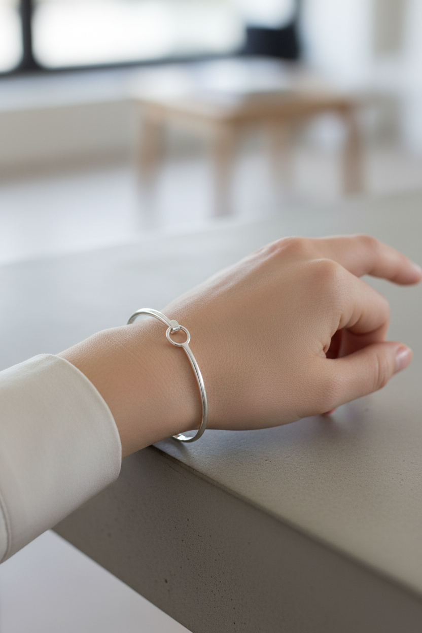 Model wearing hook closure bangle - close-up
