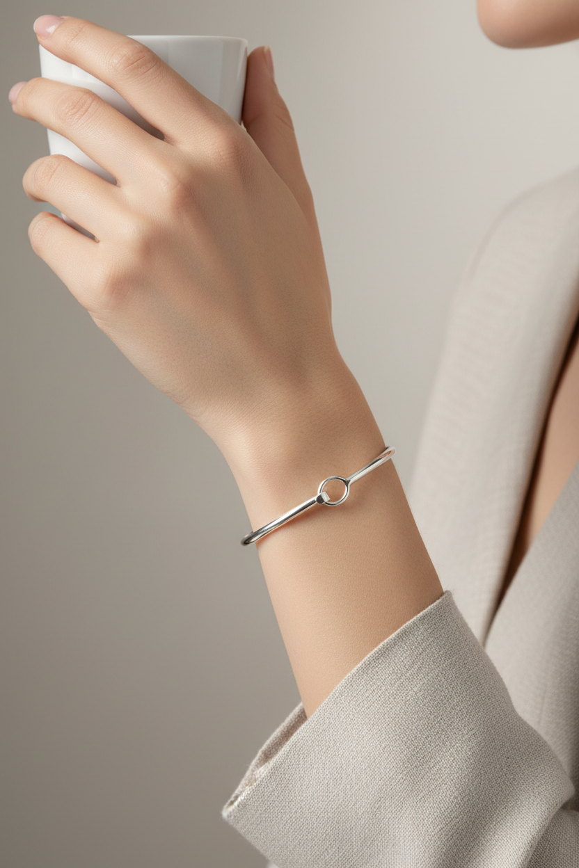 Model wearing hook closure bangle - elegant pose