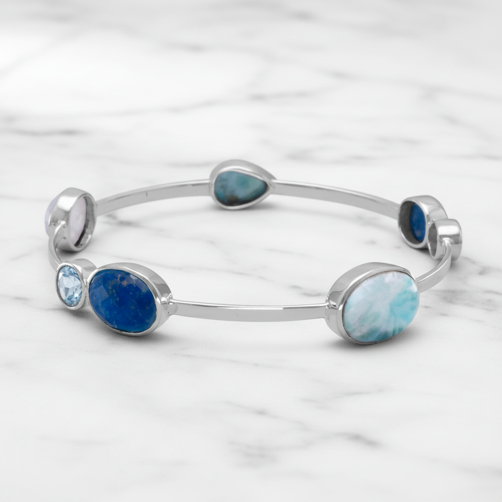 Multi-stone bangle on marble background