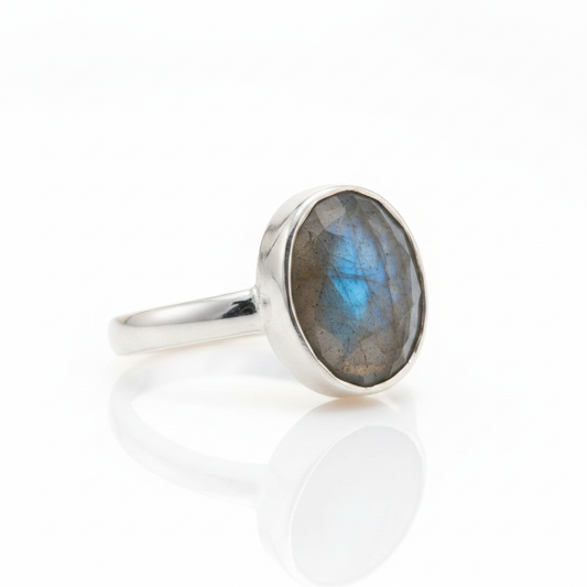 Oval Labradorite Bezel Solitaire Silver Ring Pure White Background Tilted Reflection 1x1