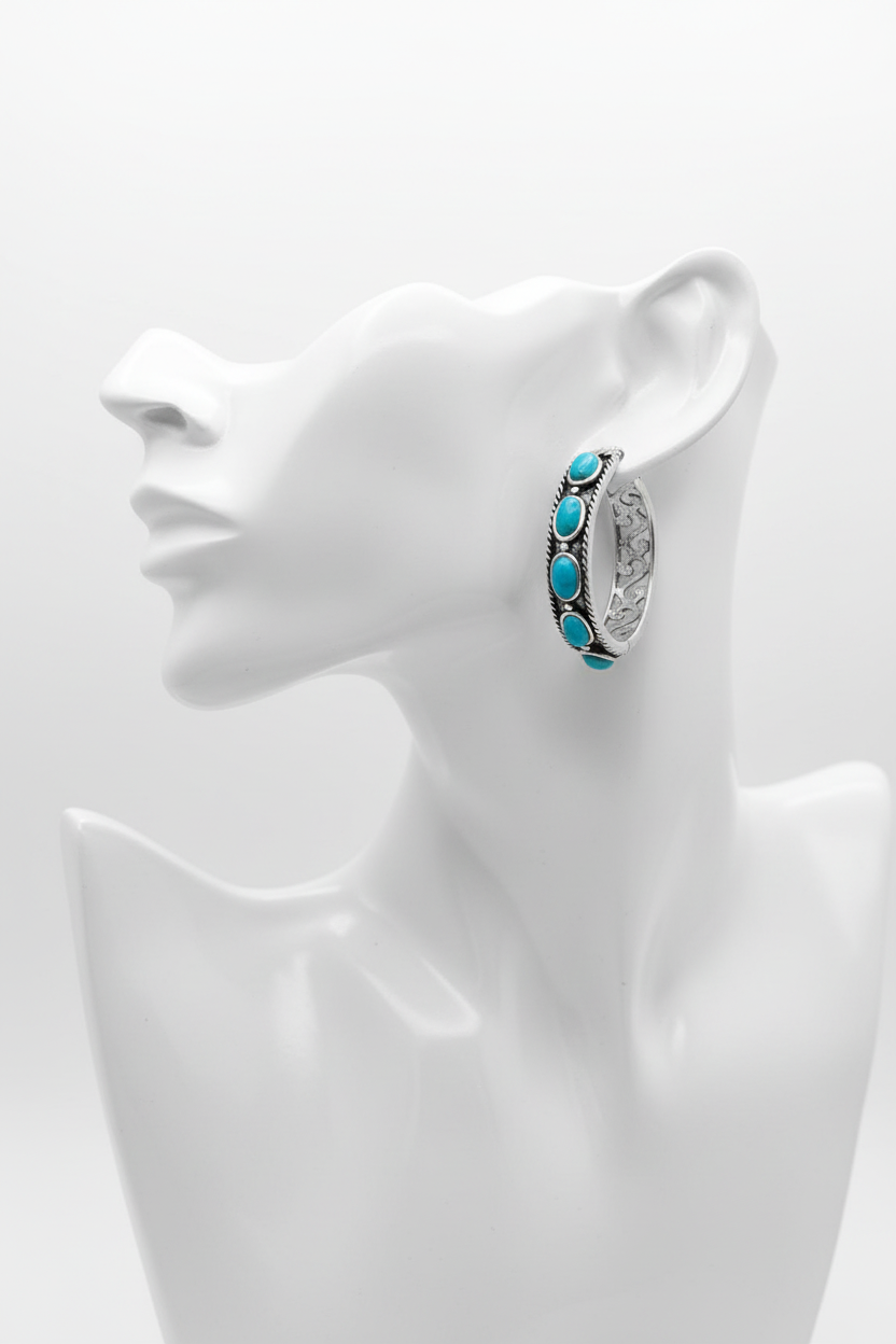 Oxidized silver turquoise hoops on white mannequin