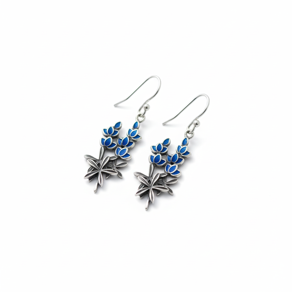Pair of blue enamel floral earrings on white