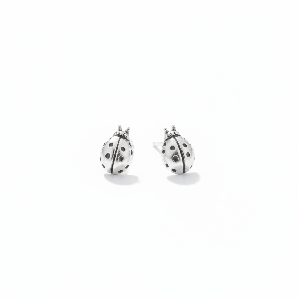 Pair of ladybug studs on white