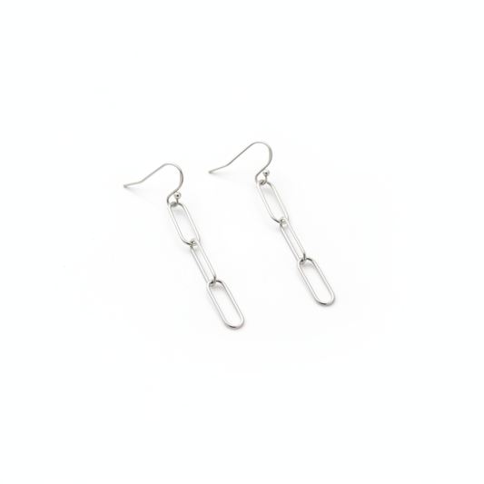 Pair of paperclip chain earrings on white