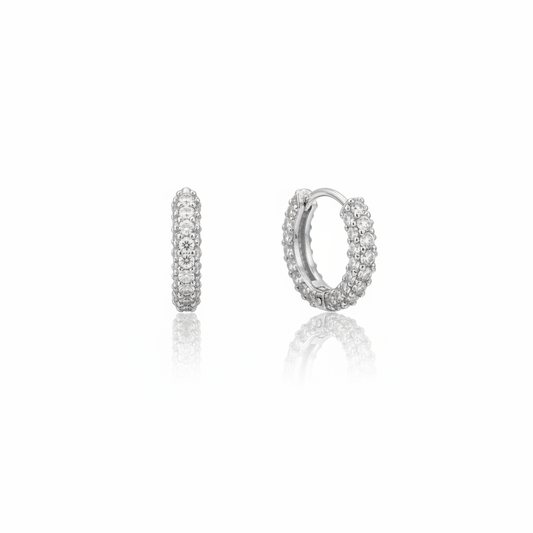 Pair of rhodium CZ click hoops on white