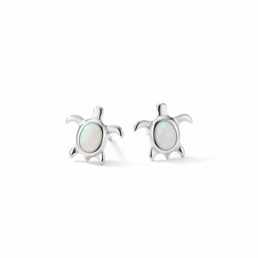 Pair of sea turtle earrings side by side