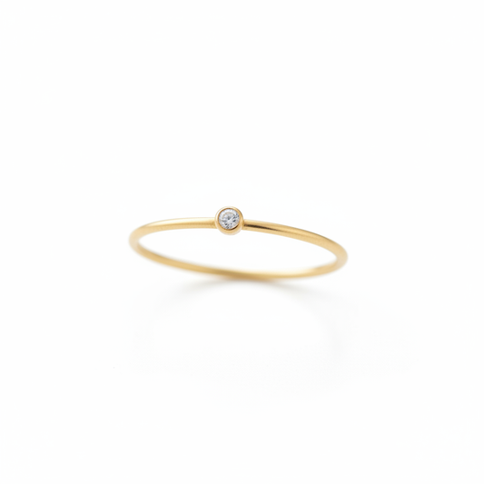 Single Stone Minimalist Gold Ring Angled White Background HD