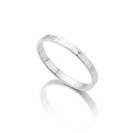 Thin Hammered Faceted Flat Band Silver Ring Pure White Background Tilted Reflection 1x1