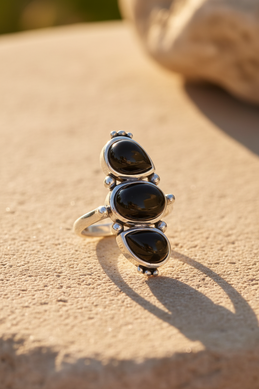 Three Stone Vertical Black Onyx Silver Ball Ring Sunlight Background
